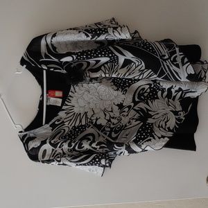 Beautiful light weight pullover black shell with blk/wht floral draped overlay